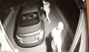 car theft 4 camera fottage of two criminals breaking into a BMW