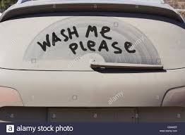 Running costs 4 dirty car door with wash me written in the dirt